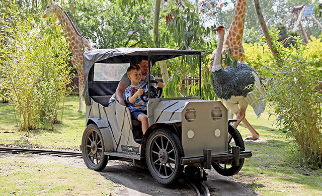 May and young girl on vintage car safari ride