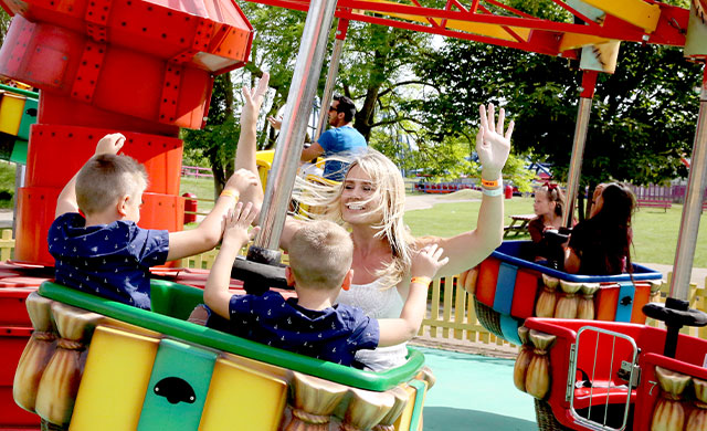 Family on balloon amusement park ride