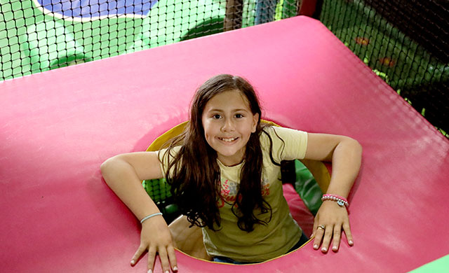 Young girl in soft play area